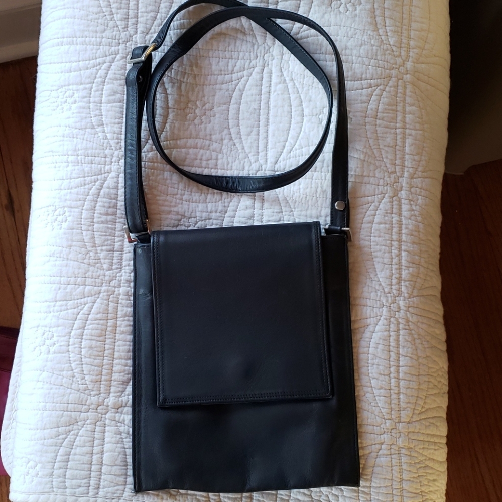 Slim black leather crossbody bag.